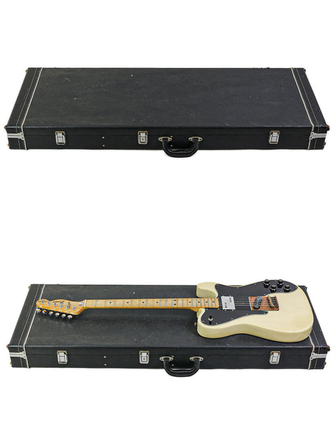 Two guitars, featuring a Fender Telecaster Custom 1978, resting in a case with a white backdrop.