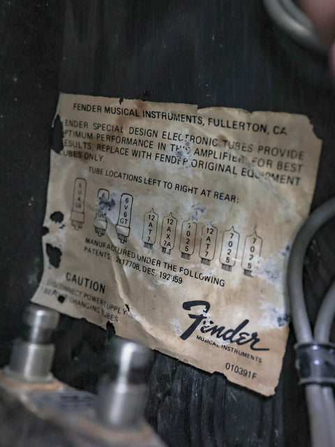 Vintage Fender guitar label from a 1977 Deluxe Reverb 1x12" combo amp, emphasizing its classic American design.
