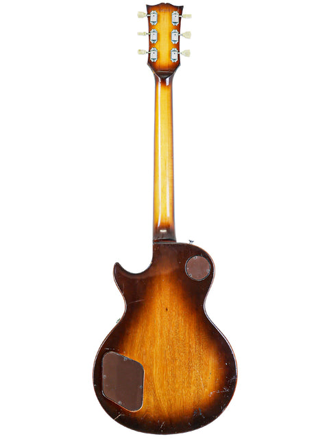 Vintage Gibson Les Paul Standard from 1979, displaying a brown body and neck, a true classic in guitar history.