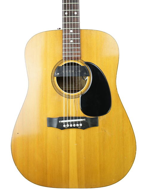 Vintage Maton FG100 guitar from 1972, featuring a wooden body and sleek black pick guard.