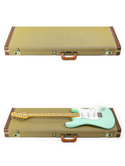 Vintage green guitar case with a brown handle, made for the iconic 1985 Fender AVRI ‘57 Stratocaster.