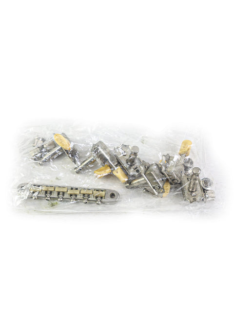 Vintage metal parts for a 1965 Gibson ES-330, displayed in plastic bags for easy identification.