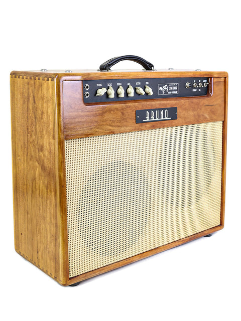 Wooden guitar amplifier with control knobs and a "Bruno" logo, isolated on a white background.