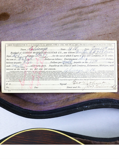 1955 Gibson Les Paul Custom with Jimmy Page's signature, a rare vintage guitar symbolizing rock history and artistry.