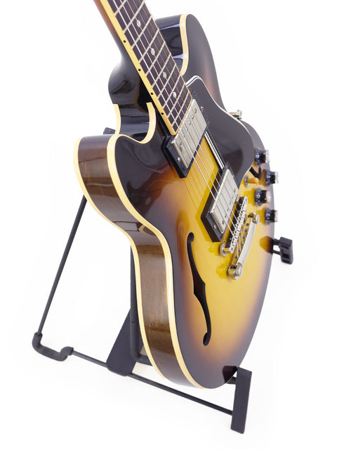 2009 Gibson Custom Shop ES 339 Memphis guitar is displayed on a stand, highlighting its sleek design and quality.