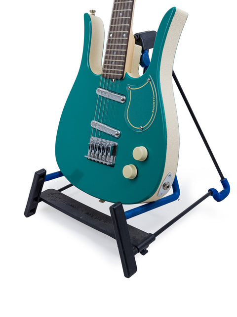 A 2005 Jerry Jones Neptune Shorty 12-string electric guitar with a blue body resting on a stand.