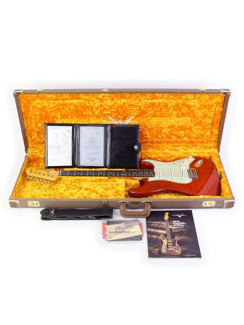 A 2019 Fender Custom Shop Stratocaster in its case, accompanied by accessories, highlighting premium design and quality.