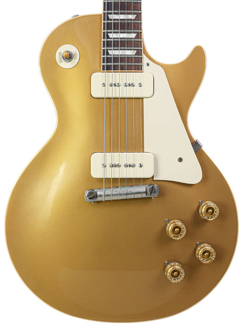 A Gibson Les Paul Custom Goldtop guitar, model LPR-4, 1954 Reissue, USA, from 2011, showcasing its iconic design and finish.