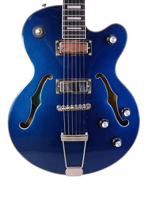 A blue Epiphone UpTown Kat ES guitar featuring a sleek black pickguard, showcasing its stylish design and craftsmanship.