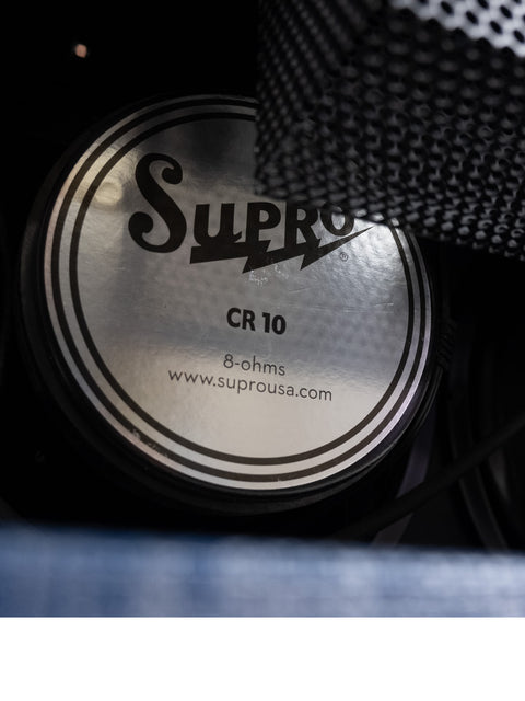 A detailed view of the Supro Royal Reverb 1650 RT Combo speaker, featuring its logo prominently.
