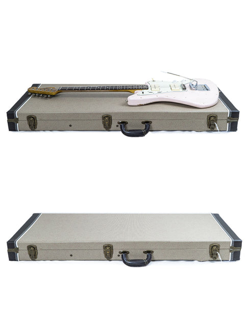 A guitar rests on top of two stacked cases, with another guitar case below, marked Rittenhouse JM-63 – USA 2020.