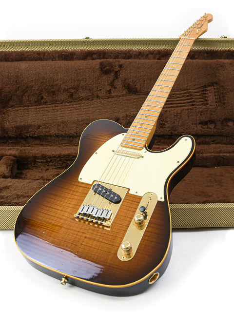 A limited edition Fender Telecaster guitar nestled in a brown case, celebrating its 40th anniversary from 1988.
