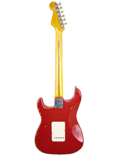 A red guitar with a yellow neck and white body, showcasing the Fender Custom Shop ’56 Stratocaster Relic from 2008.