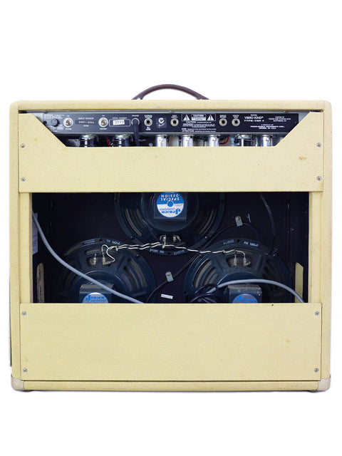 A white Fender Custom Shop Vibro-King Combo Amp from 2003, featuring two speakers inside for rich sound quality.