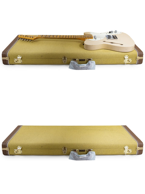 A white background showcases two unique guitar cases, including a Fender Custom Shop Limited Edition '50s Thinline Relic Telecaster.