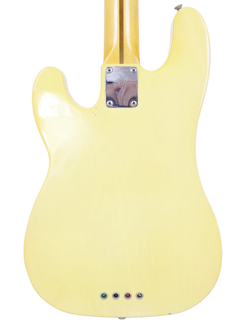 A yellow electric guitar with a white body, featuring the vintage style of a 1968 Fender Telecaster Bass.