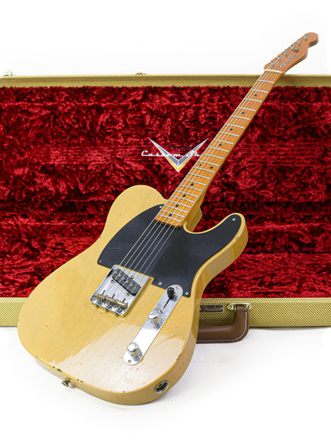A yellow guitar, the Fender Master Built Jason Smith Esquire, securely in a case with a rich red velvet cover, USA 2018.