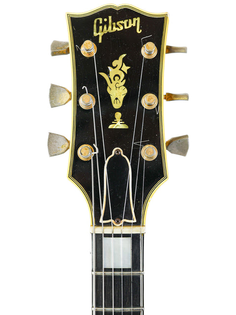 Beautiful Gibson Les Paul Custom '62, representing vintage craftsmanship, alongside a classic 1966 Byrdland guitar.