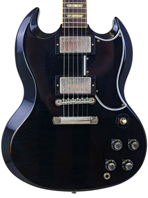 Black electric guitar with a sleek body, featuring the Gibson Custom Shop '64 SG Murphy Lab design from 2022.