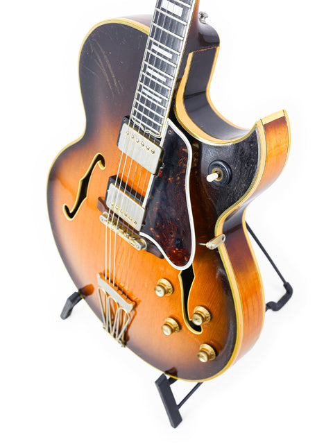 Classic 1966 Gibson Byrdland guitar in a vibrant sunburst finish, exemplifying timeless style and exceptional quality.
