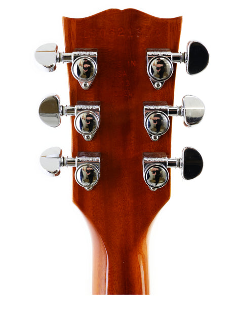 Close-up image of the headstock from a 2013 Gibson Les Paul Standard, emphasizing its intricate design and quality.