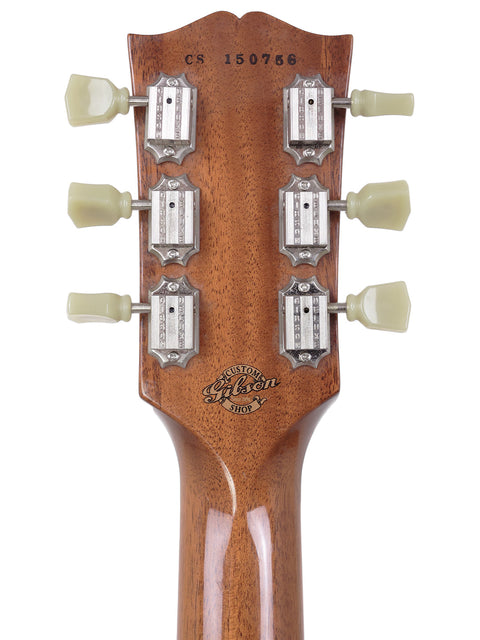 Close-up of a Gibson Custom Shop ES 339 Memphis headstock, showcasing four knobs for adjusting sound settings.