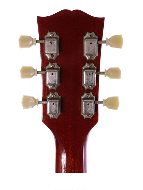 Close-up of a Gibson ES-335 Block headstock with four knobs, highlighting its classic 1963 Nashville Custom Shop craftsmanship.