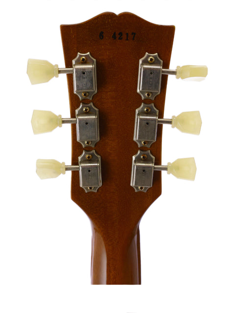 Close-up of the headstock from a 2014 Gibson Custom Historic VOS LPR-6, showcasing four tuning knobs.