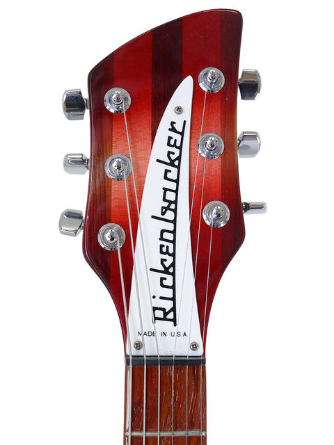 Close-up of the headstock of a 2006 Rickenbacker 330 electric guitar in Fireglo, emphasizing its classic features.