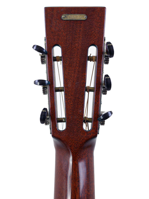 Close-up of the headstock on a 2016 National ResoRocket WB Steel acoustic guitar, highlighting its intricate details.