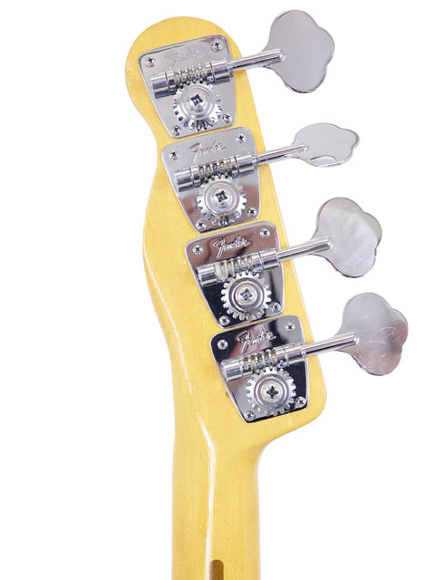 Close-up shot of a 1968 USA Fender Telecaster Bass neck, highlighting its four strings and classic craftsmanship.