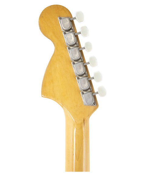 Detailed view of a 1976 Fender Bronco electric guitar head, set against a clean white background, highlighting its vintage features.