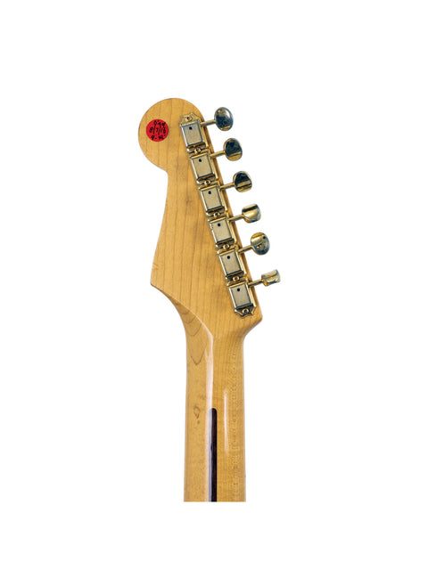 Detailed view of a 1992 Fender MIJ '57 Style Stratocaster guitar head, highlighting a prominent red dot on the tuning pegs.