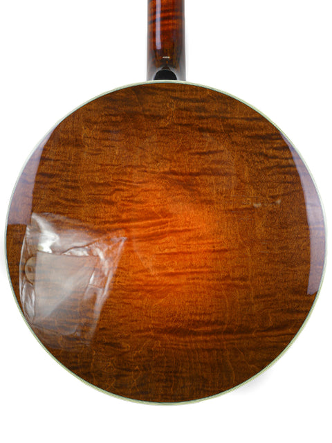 Detailed view of a brown guitar, emphasizing its elegant finish and design, featuring the Deering Golden Era Banjo made in the USA, 2008.