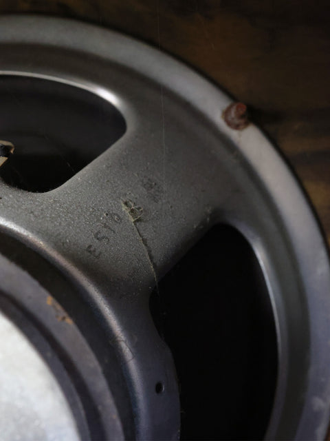Detailed view of a metal wheel featuring a hole, part of the classic 1968 VOX AC50 MKII amplifier design.