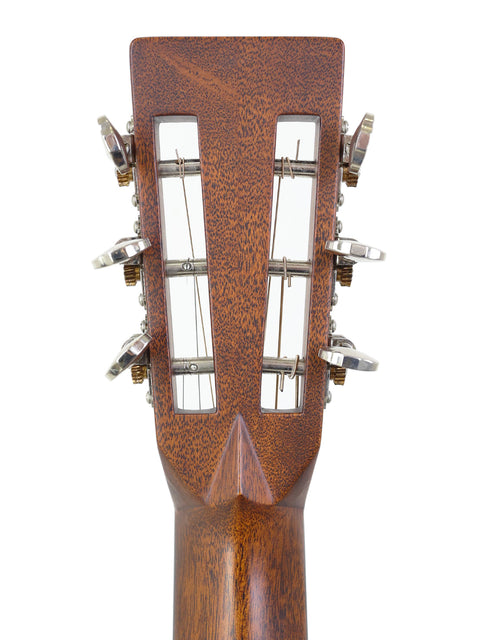 Detailed view of the headstock on a 2014 Martin 00-28VS acoustic guitar, emphasizing its fine woodwork and tuning pegs.