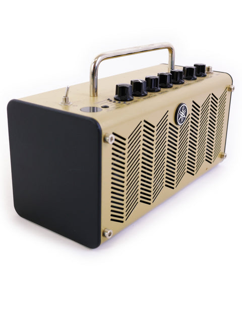 Eye-catching gold guitar amplifier with black and white stripes, the Yamaha THR5 Acoustic model from Japan, crafted in 2020.