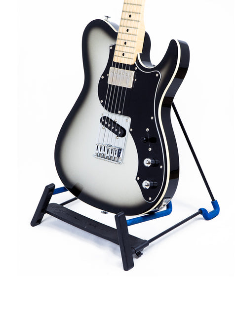 FGN Fujigen J Standard Iliad guitar with a sleek black body displayed on a stand, representing Tele style from Japan, 2015.