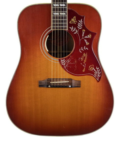 Gibson Hummingbird True Vintage acoustic guitar, USA 2012, featuring a striking sunburst finish and elegant craftsmanship.