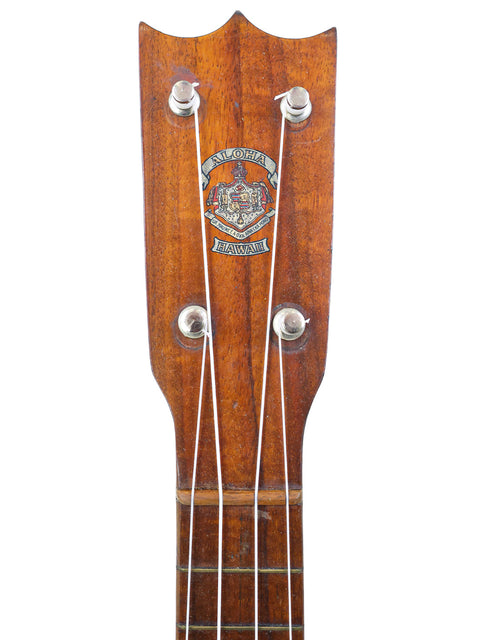 Headstock of the Aloha/Akai Style 2 Concert Ukulele, featuring the original Aloha Hawaii logo and vintage tuners.