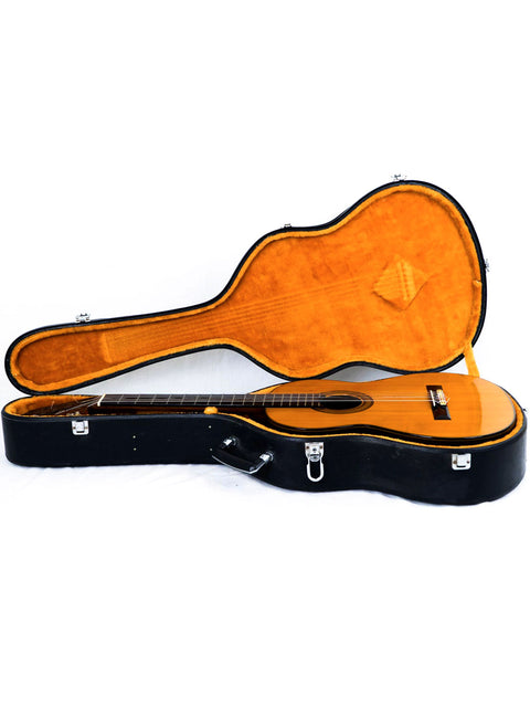 Inside a guitar case rests a Nakade Master 30 Grand Concert Guitar, crafted in Japan in 1976.