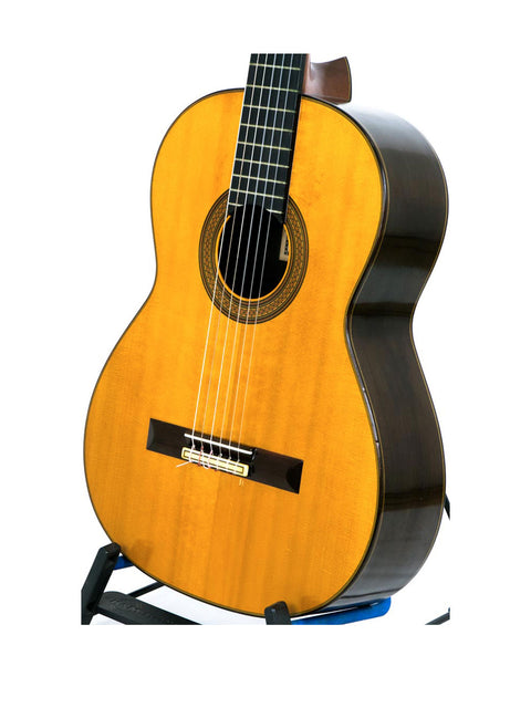 Nakade Master 30 Grand Concert Guitar, Japan 1976, elegantly positioned on a stand with a white backdrop.