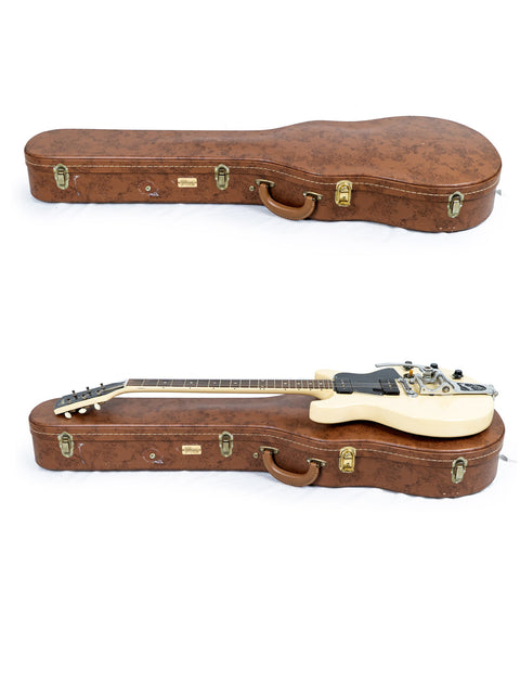 On a white background, two guitars in a case highlight a vintage 1959 Gibson Les Paul Special Refin from the USA.