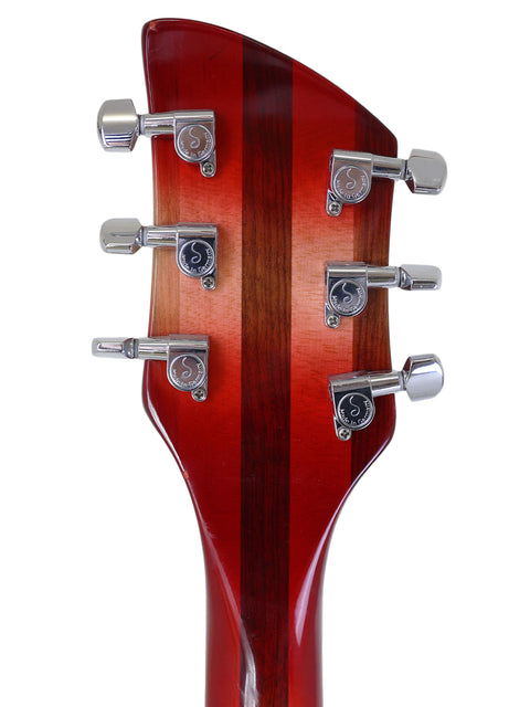 Rickenbacker 330 headstock in Fireglo finish, captured up close to reveal its elegant design and tuning hardware from 2006.