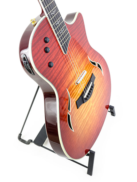 Taylor T5-C1 guitar in red sunburst finish resting on a stand, crafted in the USA in 2010.