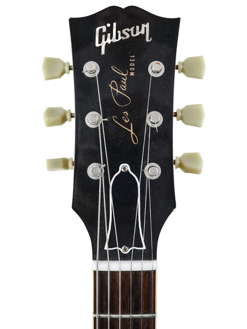 The Gibson Les Paul Custom Shop LPR-4 1954 Reissue guitar from 2011, featuring a sleek body and iconic design elements.