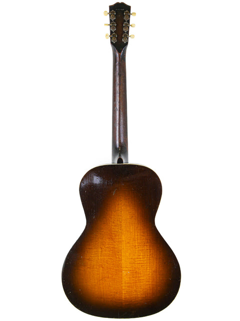 The elegant Gibson J-45 guitar, highlighting its exquisite design, alongside the historic 1936 Gibson L-C ‘Century of Progress’.