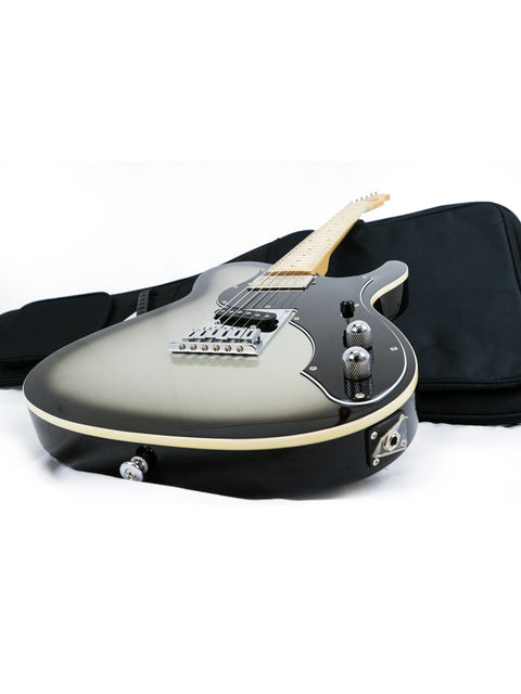 The image features a black guitar with a white pickguard, securely placed in a black case, highlighting its 2015 Japanese craftsmanship.