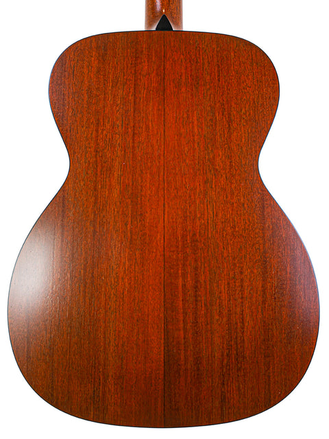 The wooden back of a Collings Julian Lage Signature OM1 acoustic guitar, highlighting its craftsmanship and design.