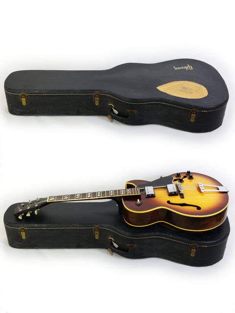Two vintage Gibson ES-175D guitars nestled in a protective case, showcasing their classic design from the 1970s.
